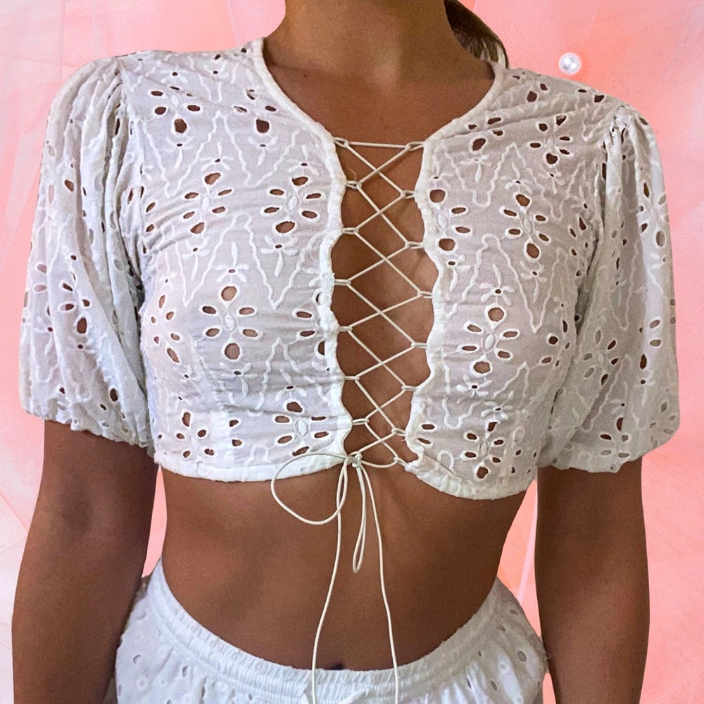 Eyelet crop top with lace up front detail. Beautiful material